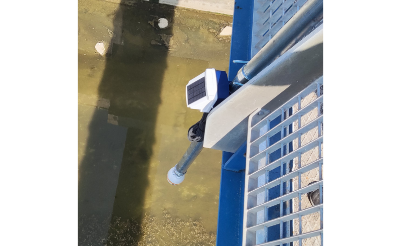 Reflect level sensor mounted over a river
